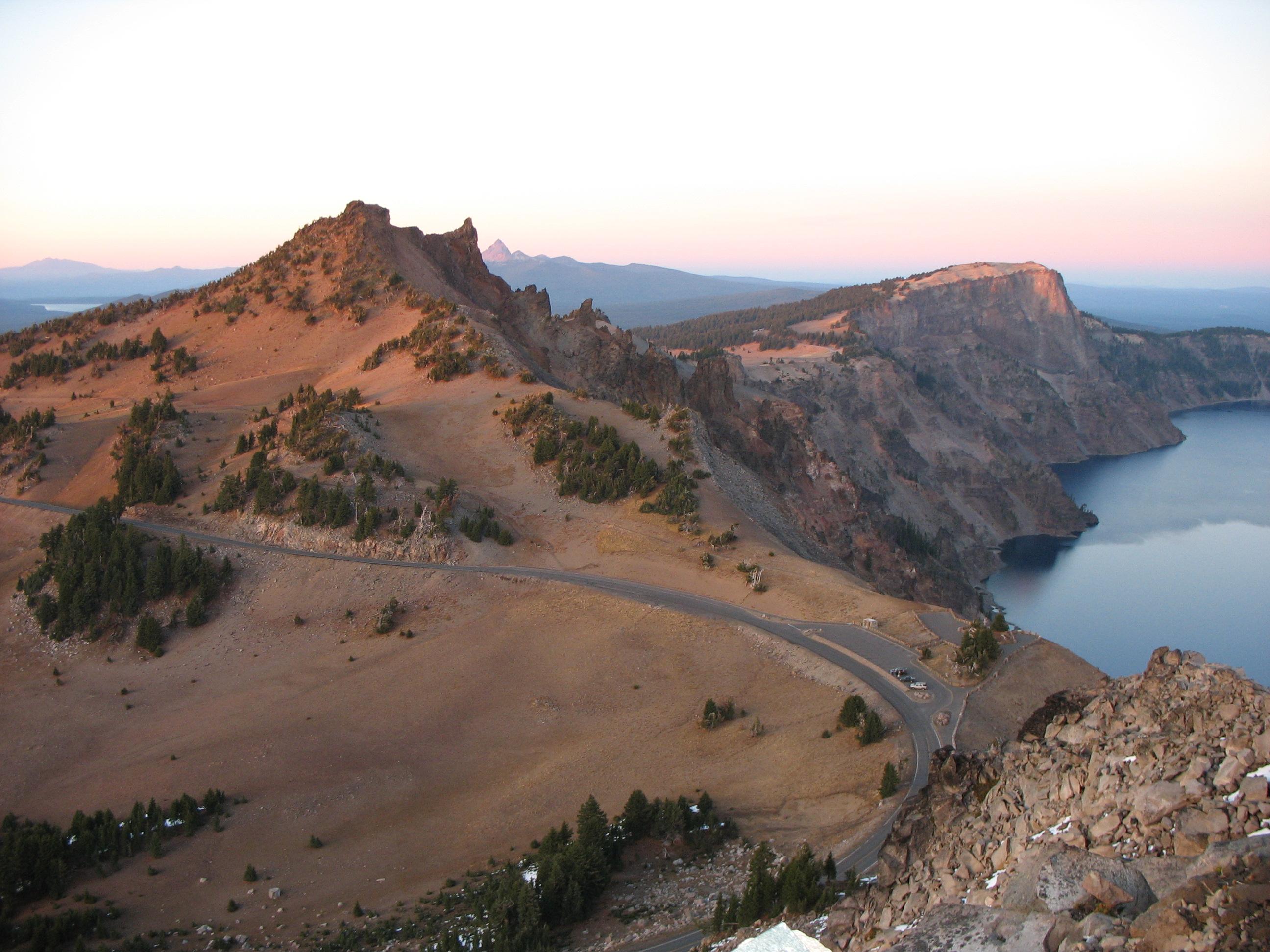 View of Rim Drive from Watchman Peak. Hillman Peak and Crater Lake in the background.