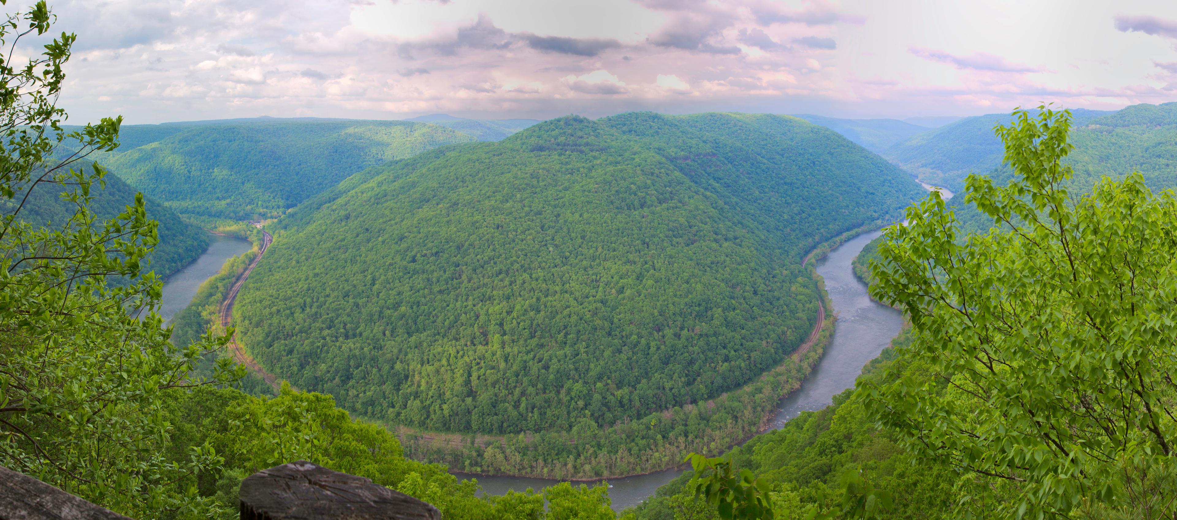 Colored photo looking down into the gorge at a bend in the New River