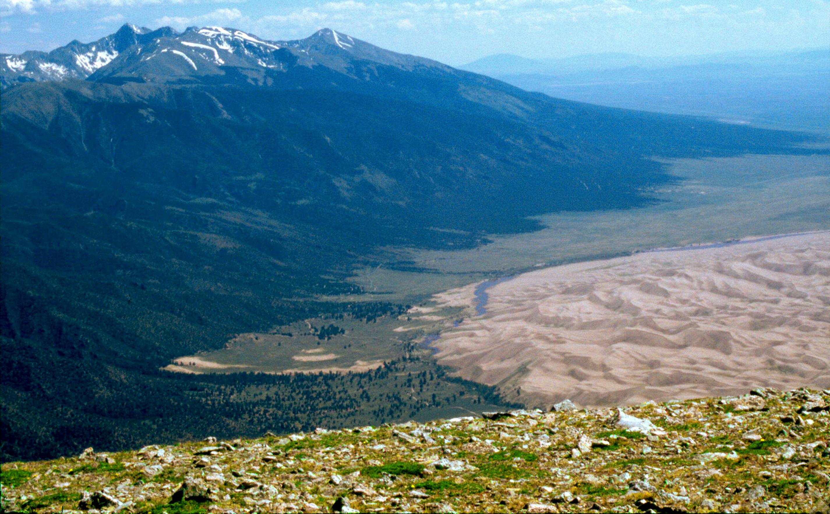 Alpine tundra in foreground, part of the dunefield at right, and snow-capped Blanca Peak