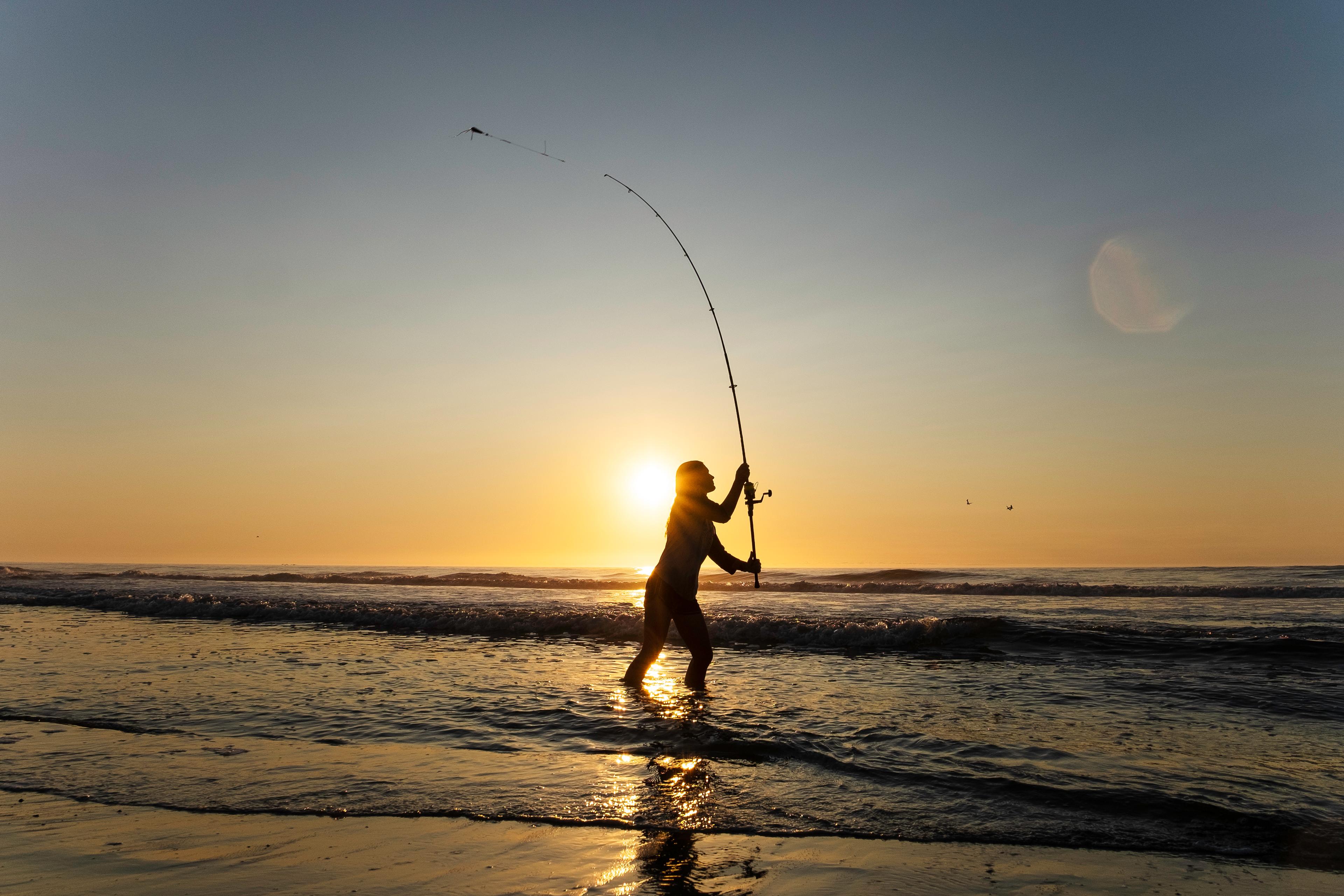 An angler on Assateague at sunrise