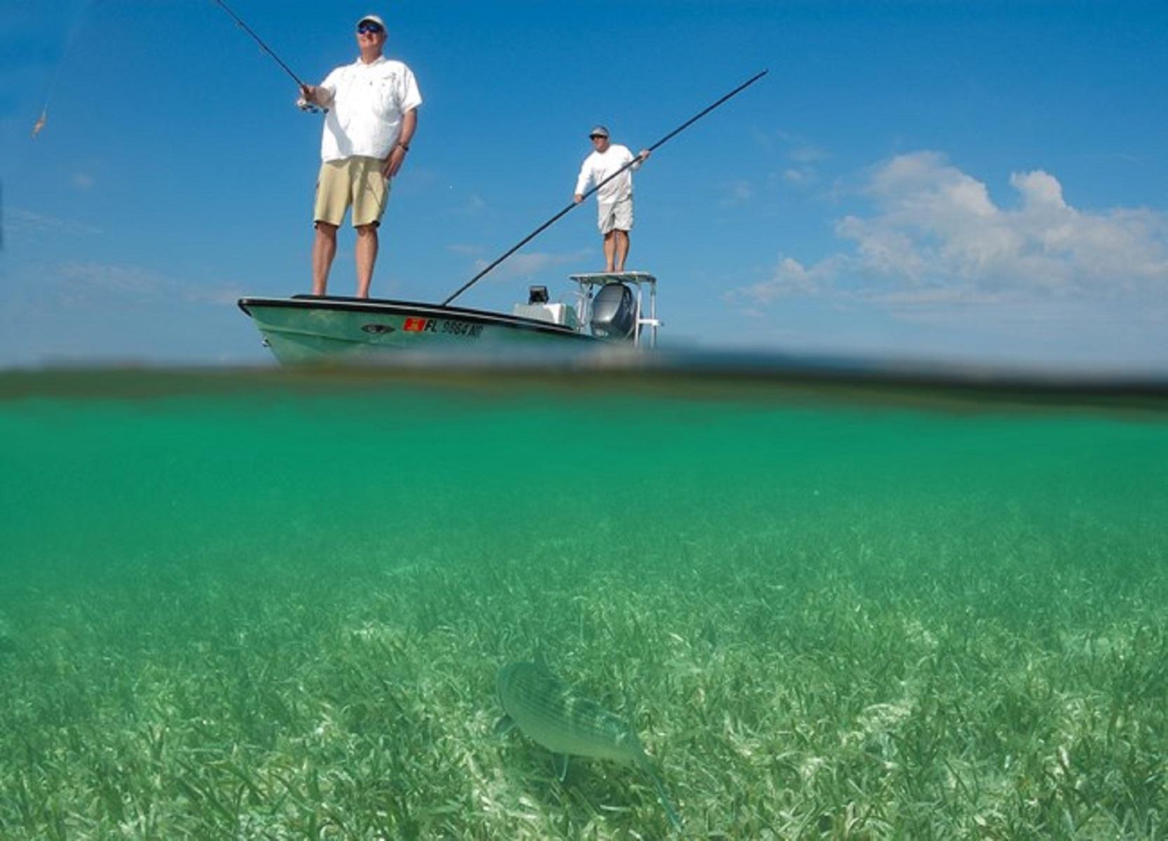 Two men fishing from a flats boat