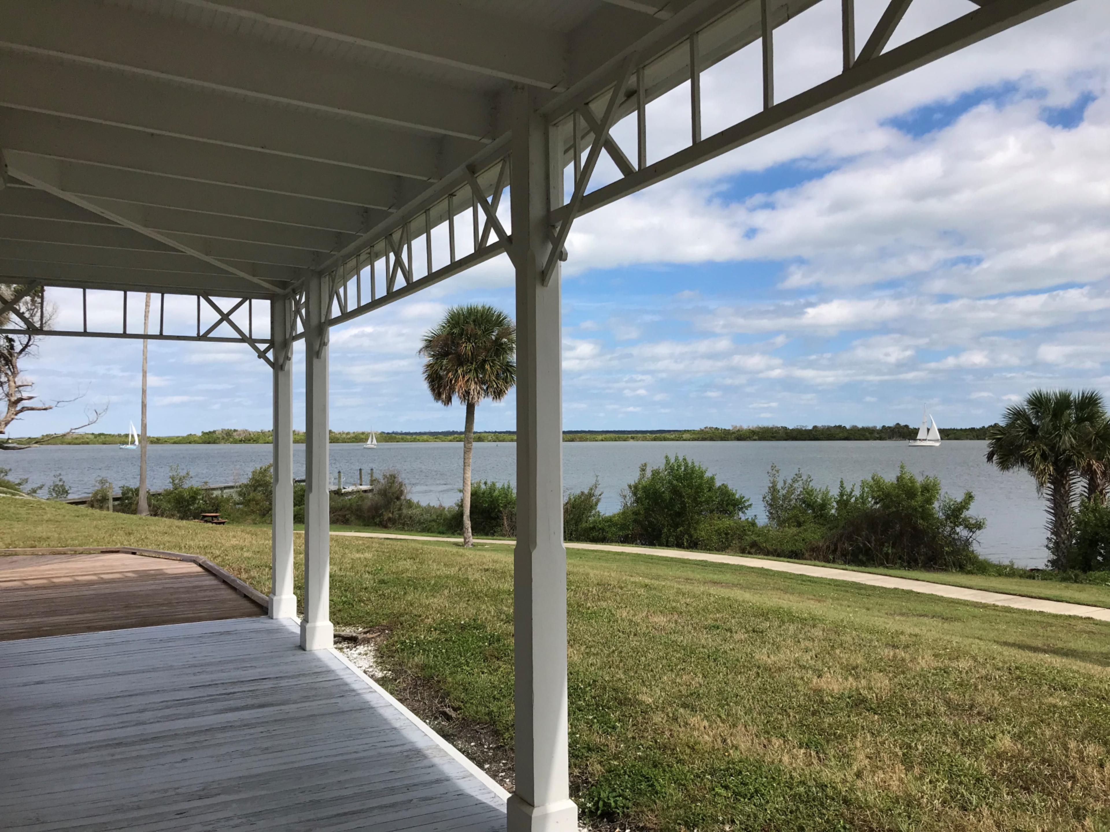 Seminole Rest porch with the lagoon in the background.