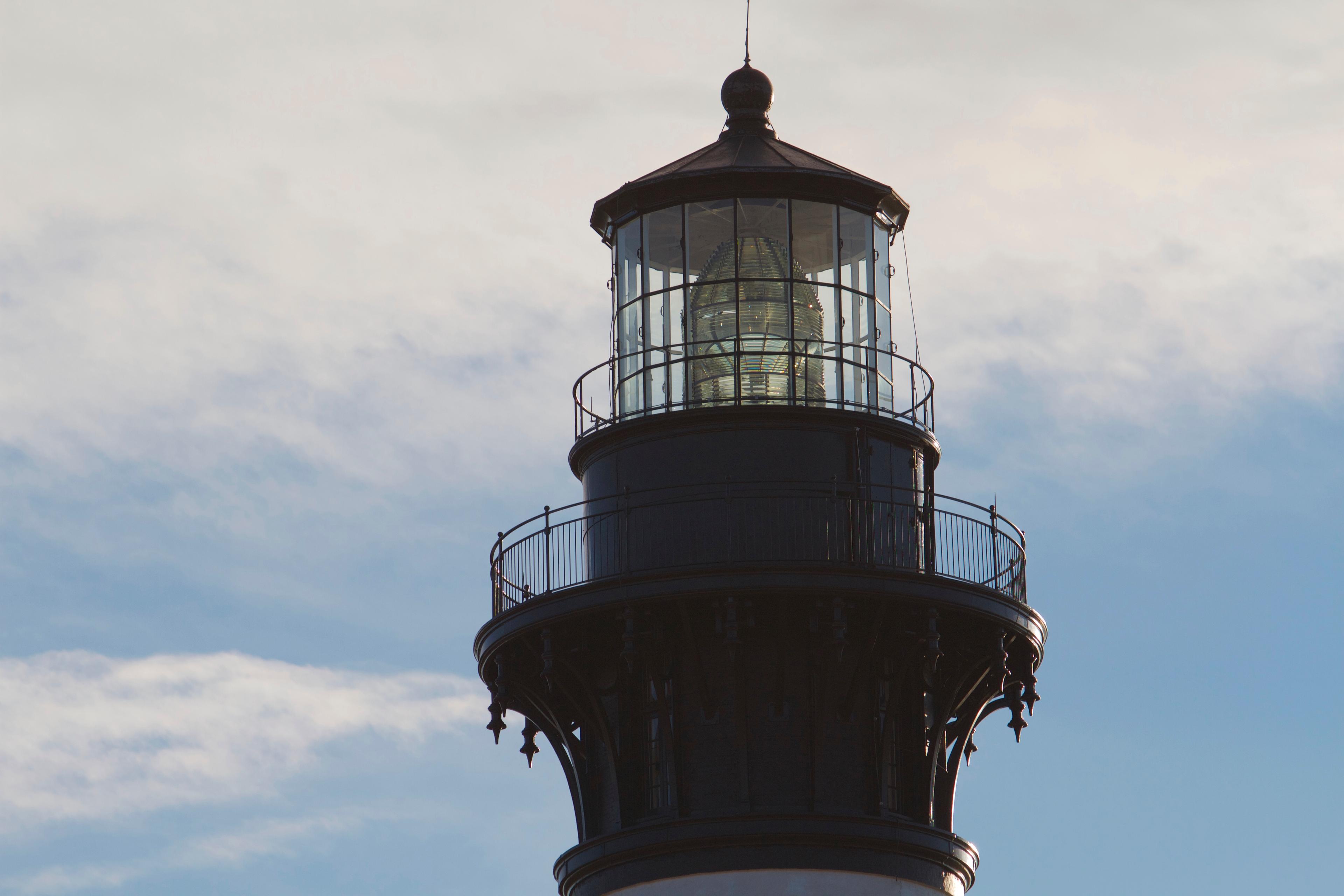 The first-order Fresnel lens is visible in the lantern room of the Bodie Island Lighthouse.