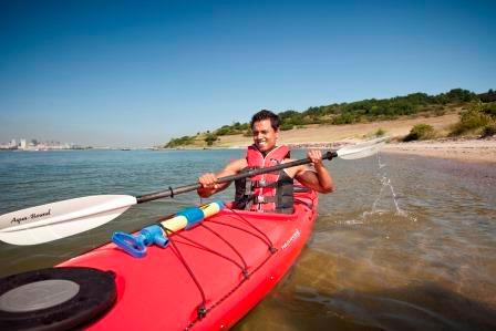 A man on a kayak in Boston Harbor